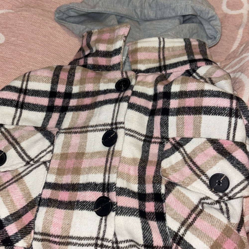 Button down Flannel, with grey hood that buttons on or you can take off.